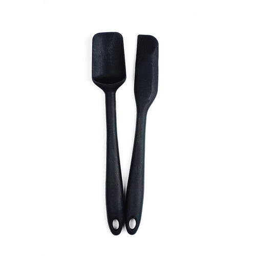 Two black silicone spatulas with metal cores and holes in the handles for hanging, displayed against a white background.