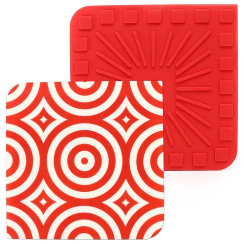 Two square silicone trivets with a geometric pattern in red color.