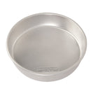 A round aluminum cake pan on a plain white background.