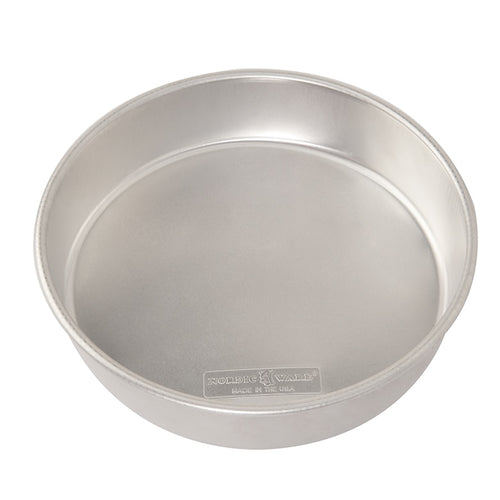 A round aluminum cake pan on a plain white background.