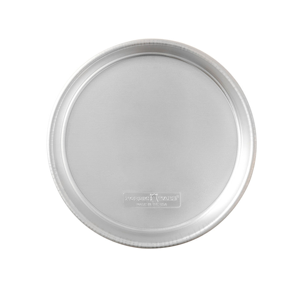 Round gray cake pan with Nordic Ware brand logo on a white background