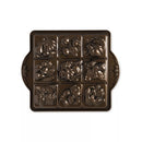 Baking mold with pumpkin and leaf designs on a white background