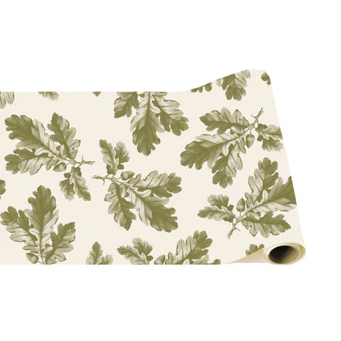 A table runner featuring oak leaves and acorns on a white background.