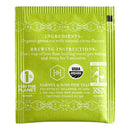 The back of a single Harney & Sons Organic Citron Green tea bag packaged in a green foil wrapper with the brand's logo and product information.