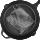 Cast iron skillet with a metal scrubber on a white background