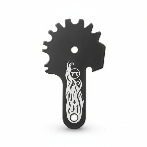 Black grill cleaning tool with sprocket-like design and white flame pattern on a white background