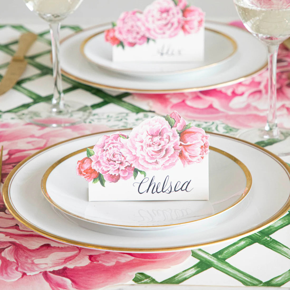 A place setting featuring a peony place card.
