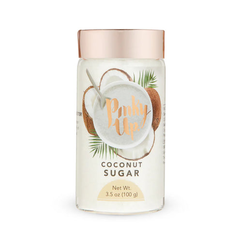 Jar of coconut sugar with a pink lid on a white background