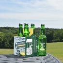 A case of Pioneer Spring Sparkling Water glass bottles placed on a table with a field in the background.