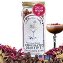 Cocktail infusion kit labeled 'Practical Magic Chocolate Martini Cardamom Rose' with a glass of cocktail and chocolate chips on a white background.