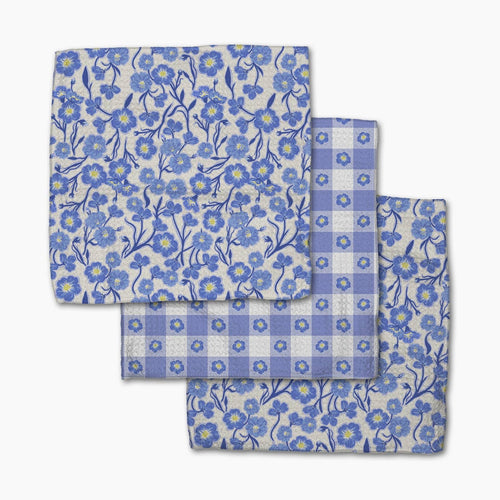 Set of blue floral and checkered dish cloths on a white background