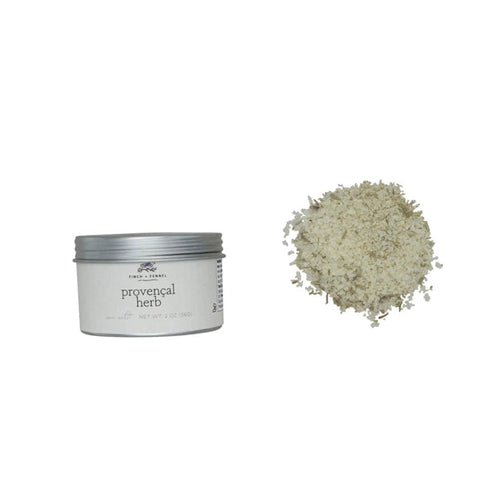 A jar of Provençal Herb Sea Salt with the label visible, displaying fine white granular substance outside the jar.