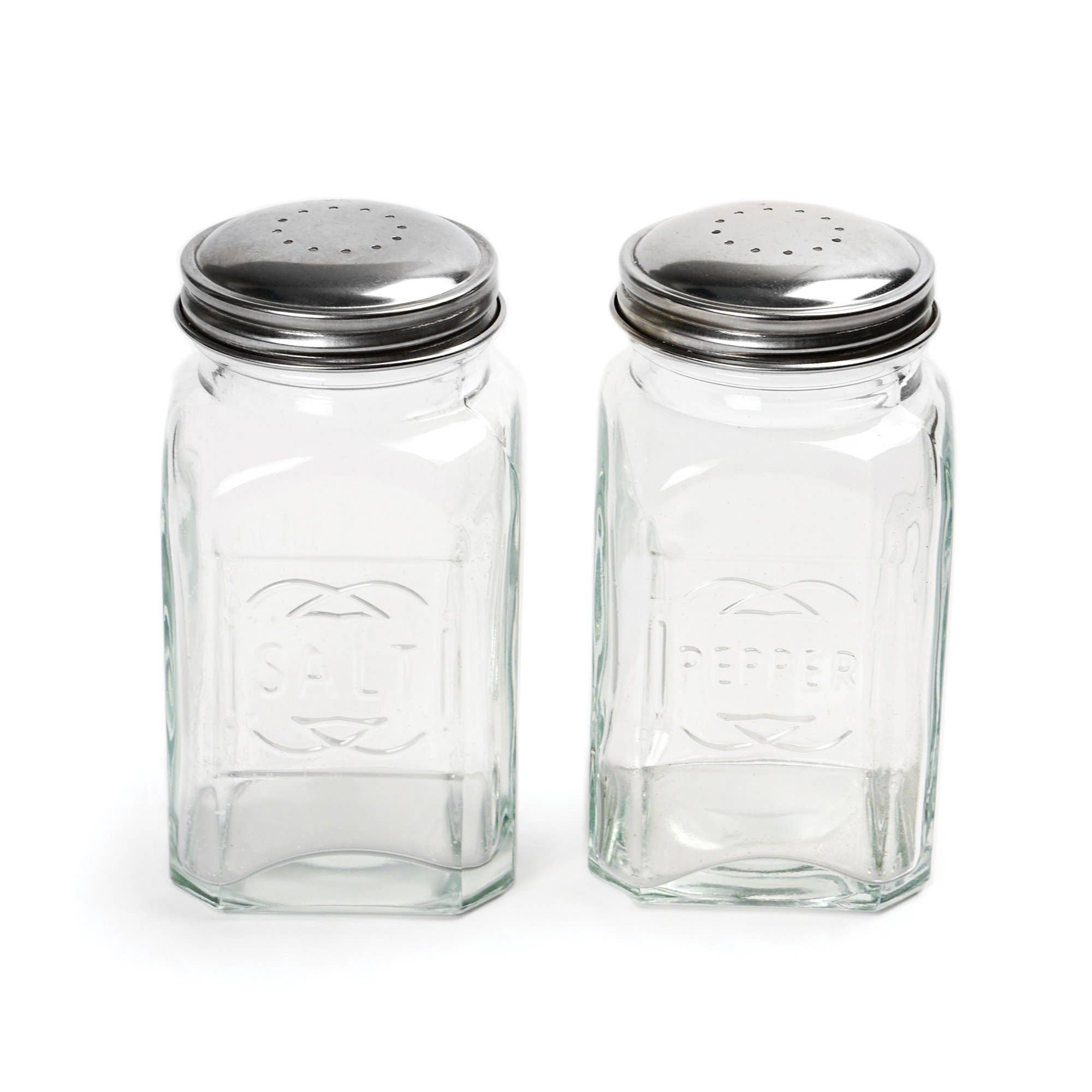 A set of two clear glass salt and pepper shakers with stainless steel lids, marked with 'Salt' and 'Pepper' on the front.