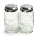 A glass salt and pepper shaker set on a white background.