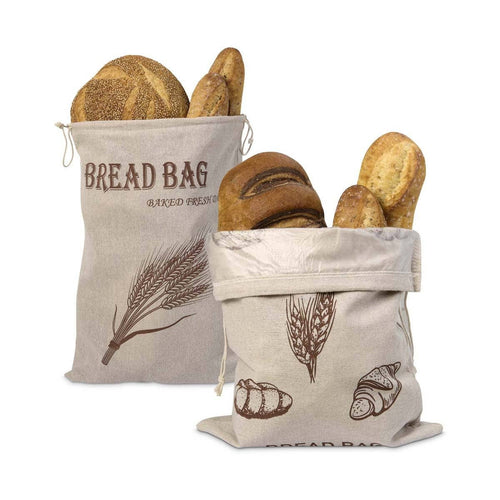Two bread bags with printed designs filled with bread on a white background
