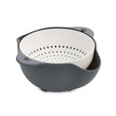Gray and white colander on a white background