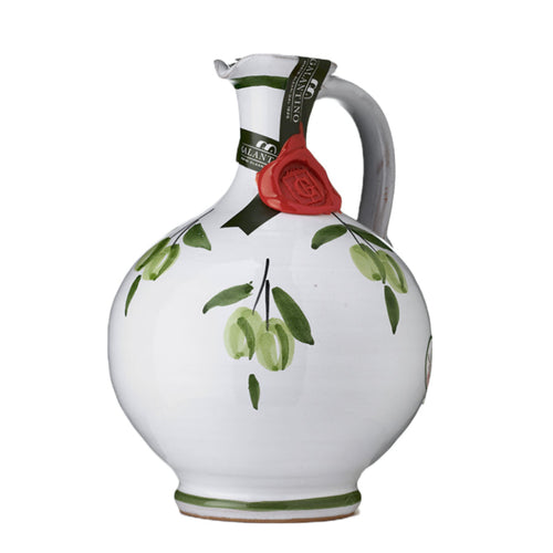 Decorative ceramic pitcher with a red rose and green leaves on a white background