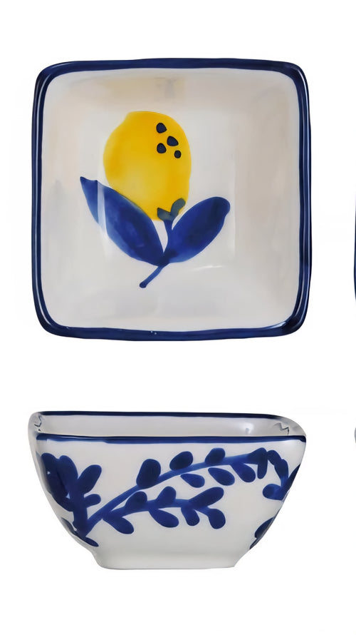 Ceramic dish set with lemon design on a white background
