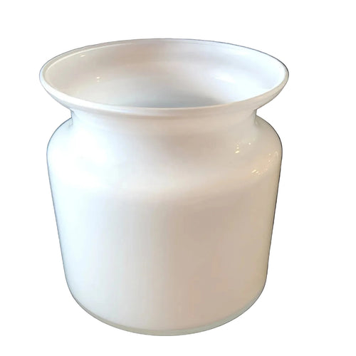 White ceramic vase emitting steam on a dark background