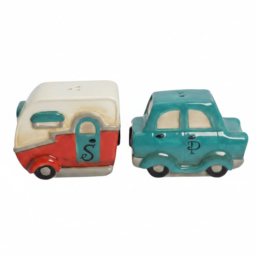 Two ceramic salt and pepper shakers shaped like a camper and a car on a white background