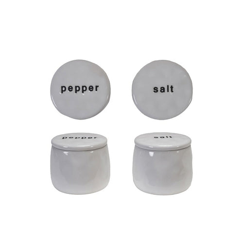 Two stoneware pinch pots, one labeled 'salt' and the other 'pepper', against a white background.