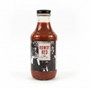 A bottle of Rowdy Red beer mix sauce with a black cap, filled with reddish-brown sauce, and featuring a vintage-style black and white label on a white background.