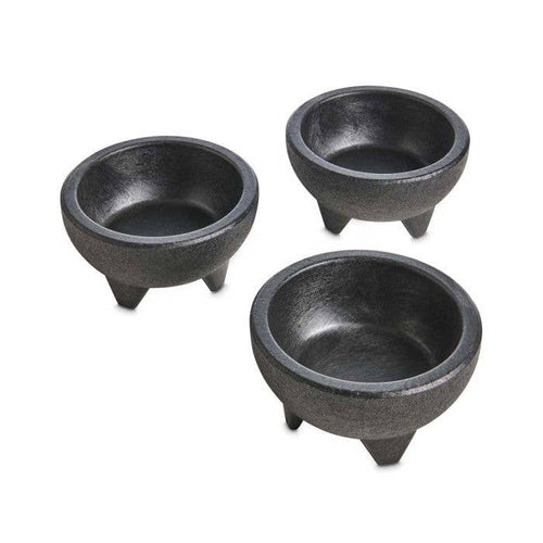 Three black bowls with tripod bases on a white background