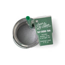 Stainless steel tumbler with green straw and green label on a white background