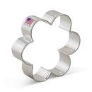 Metallic flower-shaped cookie cutter on a white background