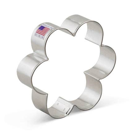 Metallic flower-shaped cookie cutter on a white background