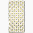 Patterned towel with green and blue design on a white background