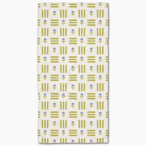 Patterned towel with green and blue design on a white background