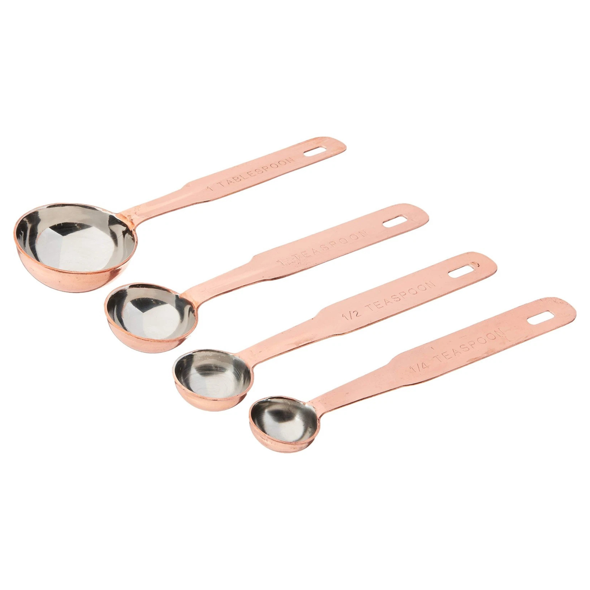 Four copper measuring spoons, arranged by size on a plain white background.