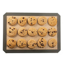 Silicone baking mat with chocolate chip cookies on a white background