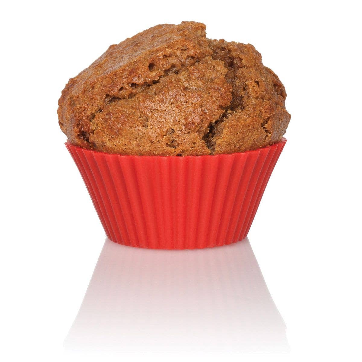 Brown muffin in a red silicone cupcake liner on a white background