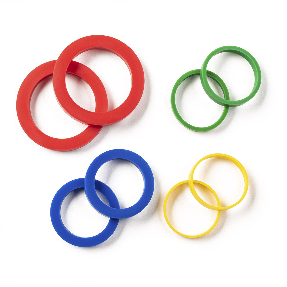 Four sets of silicone rings in red, green, blue, and yellow in different sizes for rolling pins on a white background.