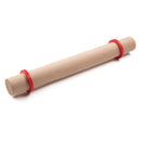 A rolling pin with a set of red silicone rings on each end on a white background.