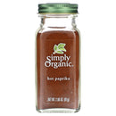 A glass jar of Simply Organic Hot Paprika, showing ground paprika inside the jar with a green lid, labeled with the brand and product name.