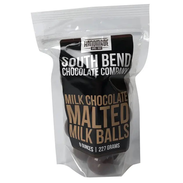 Packaged milk chocolate malted milk balls from South Bend Chocolate Company on a white background