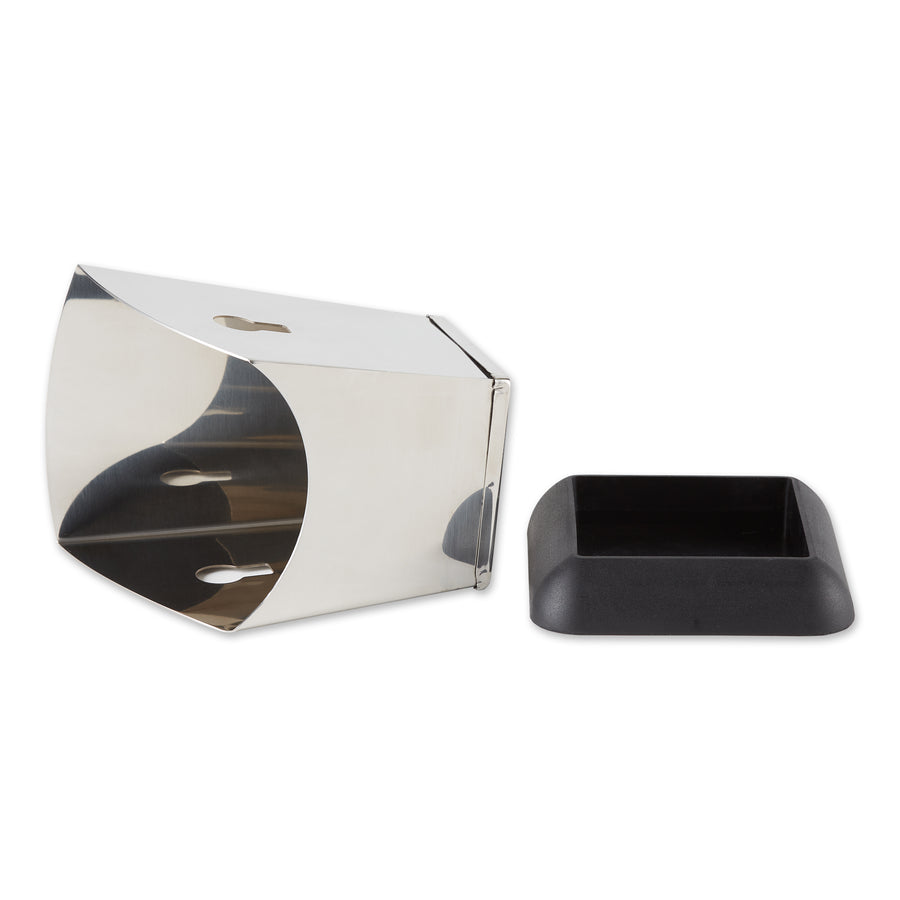 A stainless steel knock box lying on its side with a rubber base beside it on a white background.