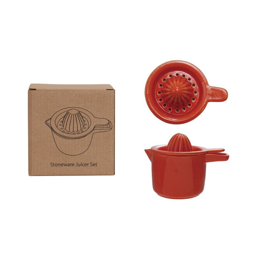 Red stoneware juicer set with packaging on a white background