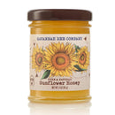 A small 3oz jar of Savannah Bee Company sunflower honey on a white background.