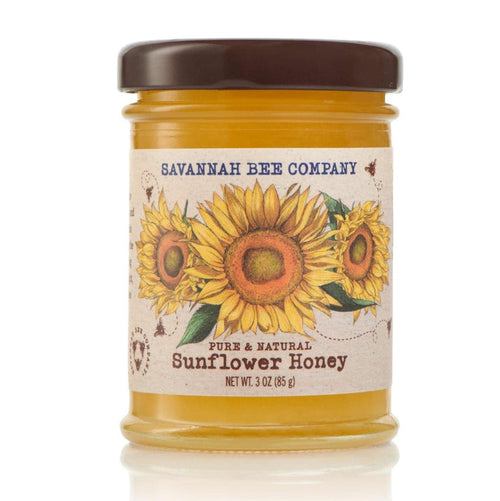 A small 3oz jar of Savannah Bee Company sunflower honey on a white background.