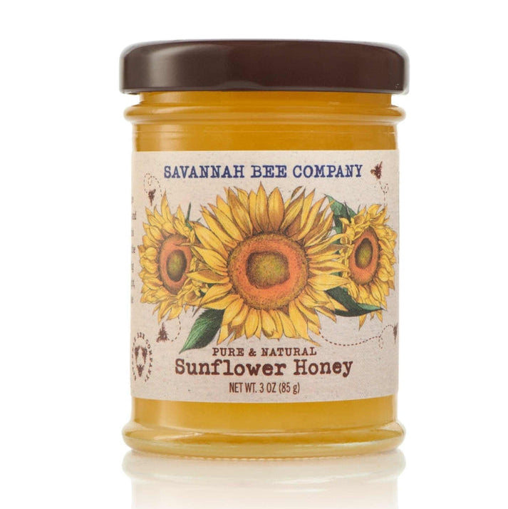 A small 3oz jar of Savannah Bee Company sunflower honey on a white background.
