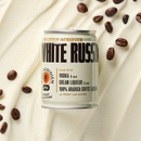 A single can of White Russian is centered on a warm cream background with scattered coffee beans around it. 