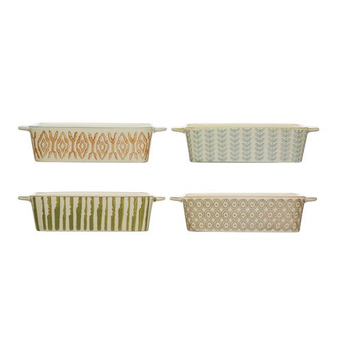 A set of four hand-stamped stoneware bakers in different colors with geometric patterns.