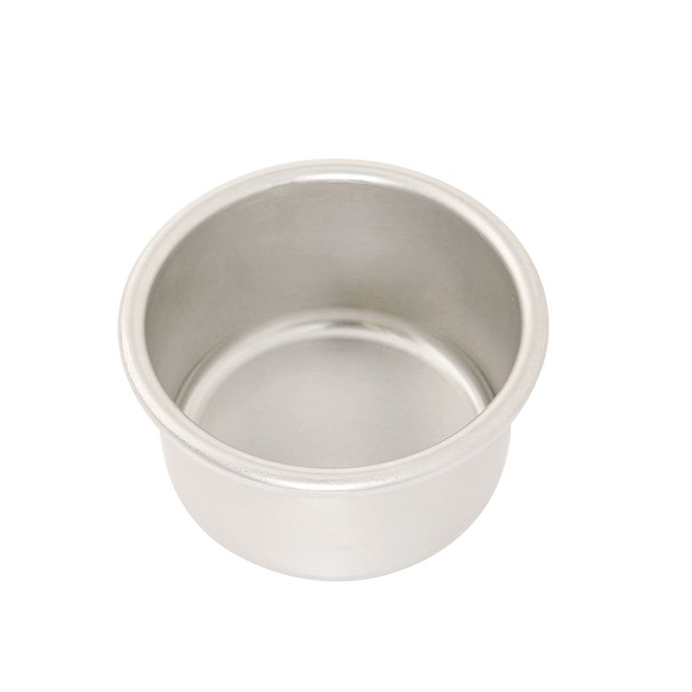 A four inch round cake pan on a white background.