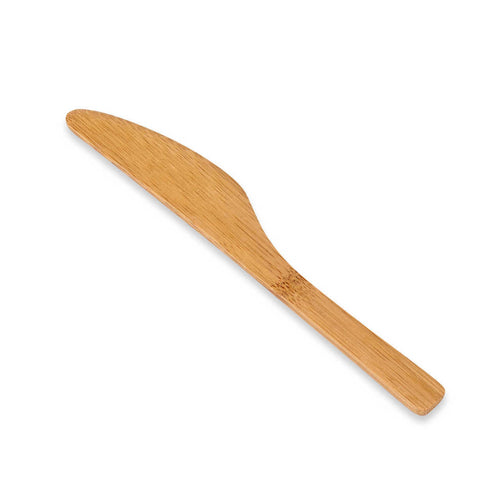 A bamboo spreader knife on a white background.