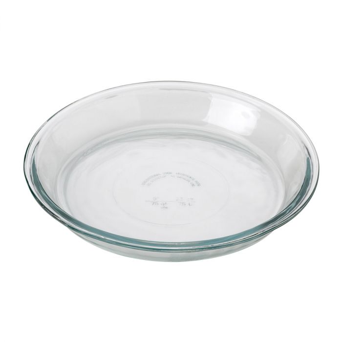 A clear glass pie plate on a white background.