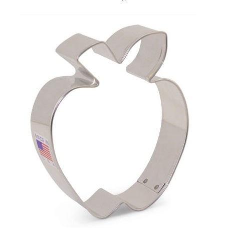A stainless steel apple-shaped cookie cutter with a leaf detail on top.